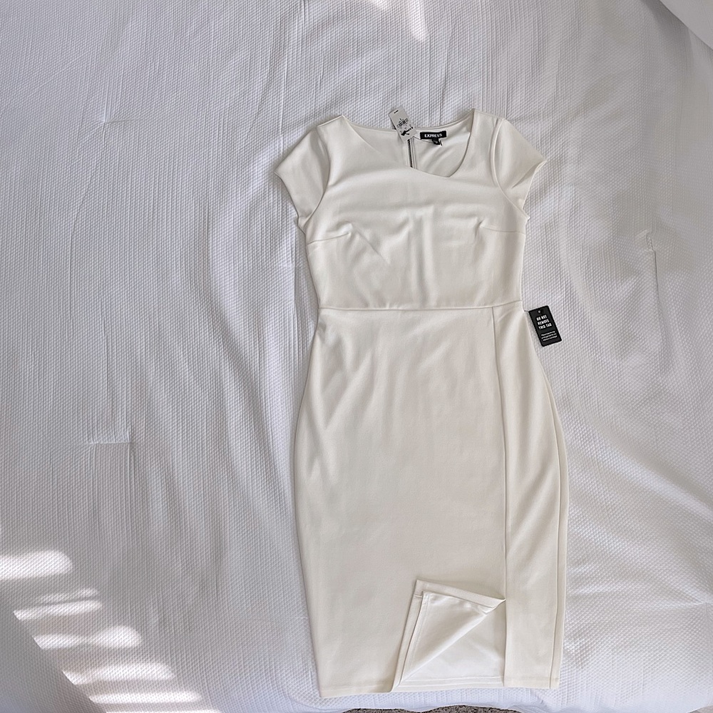 Brand New, ivory colored Express dress, size small with slit in front.
